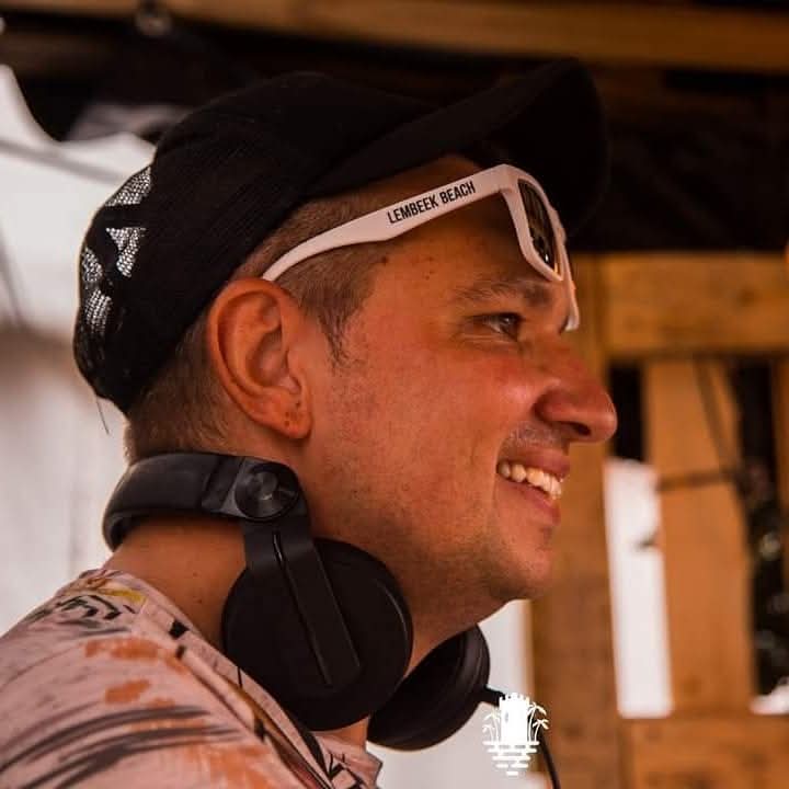 NERVOU5 smiling with headphones